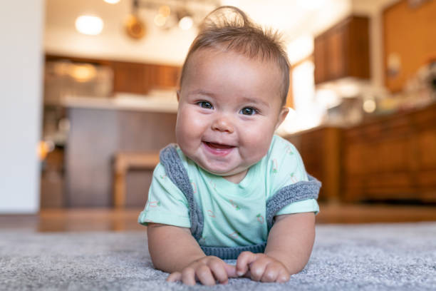 Baby laying on carpet flooring | West River Carpets